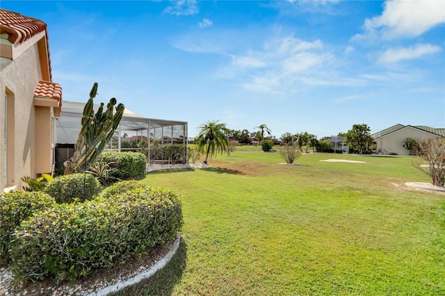 view of yard featuring a lanai