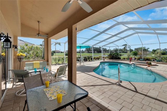 view of swimming pool with glass enclosure, ceiling fan, and a patio area