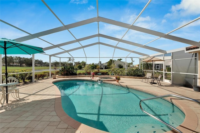 view of pool with an in ground hot tub, a patio, and glass enclosure