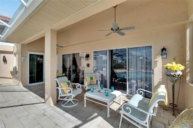 view of patio / terrace featuring ceiling fan