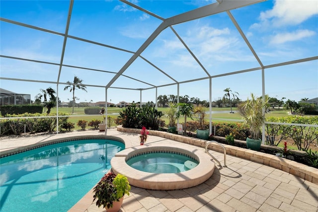 view of swimming pool featuring a lanai, an in ground hot tub, and a patio