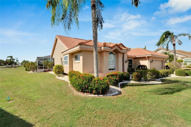 view of side of home with a lawn, a lanai, and a garage