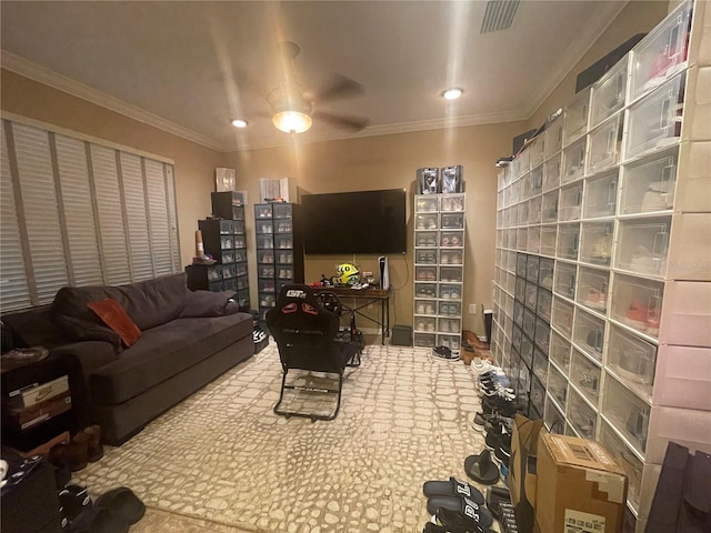 living room featuring ceiling fan and ornamental molding