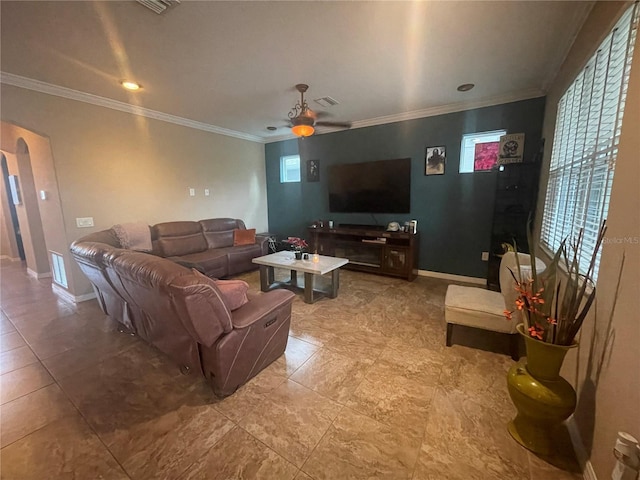 living room with ceiling fan and crown molding