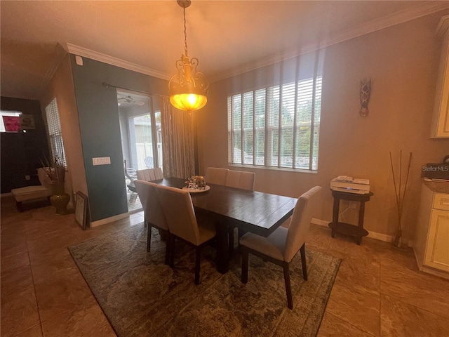 dining area with plenty of natural light and ornamental molding