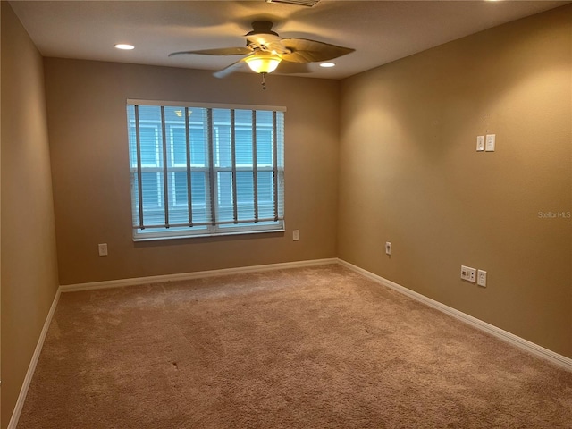 empty room with carpet floors and ceiling fan