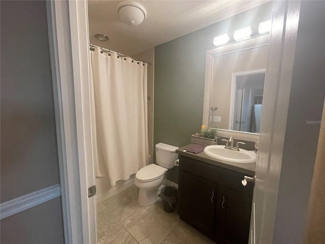 full bathroom featuring tile patterned floors, toilet, a textured ceiling, vanity, and shower / tub combo