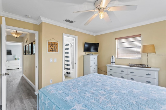 19807 Gulf Blvd Unit 128, Indian Shores, FL 33785 - bedroom with ornamental molding, wood finished floors, baseboards, and ceiling fan