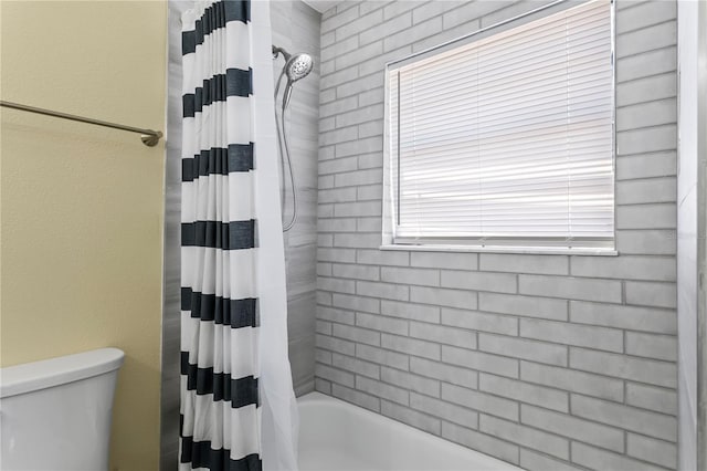 19807 Gulf Blvd Unit 128, Indian Shores, FL 33785 - bathroom with shower / bath combo with shower curtain and toilet