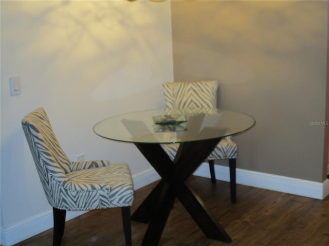 dining room featuring dark hardwood / wood-style flooring