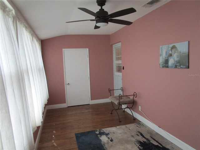 interior space with ceiling fan and wood-type flooring