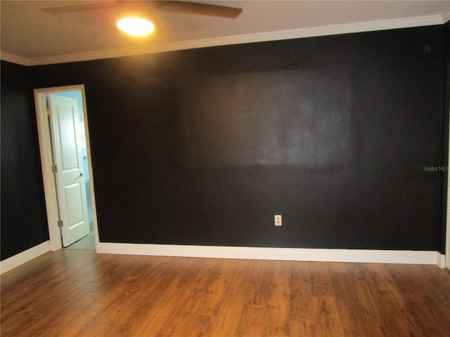 spare room featuring wood-type flooring, ceiling fan, and crown molding