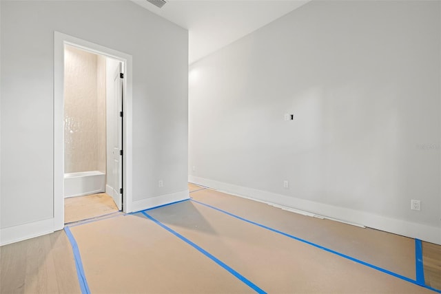 unfurnished room featuring hardwood / wood-style floors