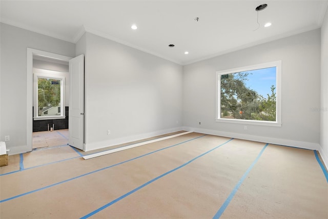 empty room with a wealth of natural light and ornamental molding