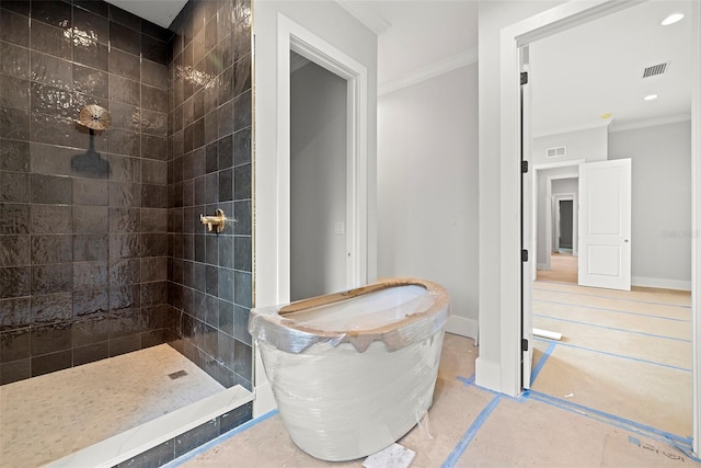 bathroom featuring tiled shower and ornamental molding