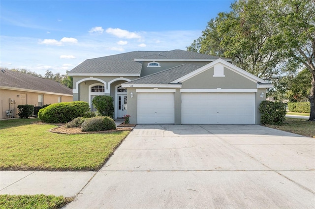 front of property with a front lawn and a garage