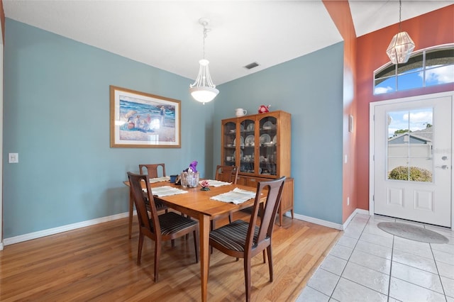 dining space with hardwood / wood-style floors