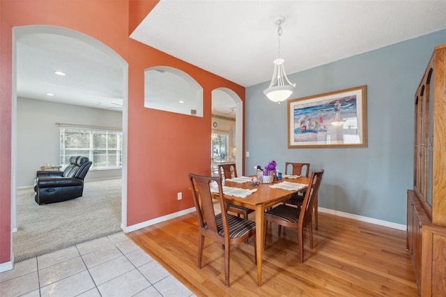 dining area with light hardwood / wood-style floors