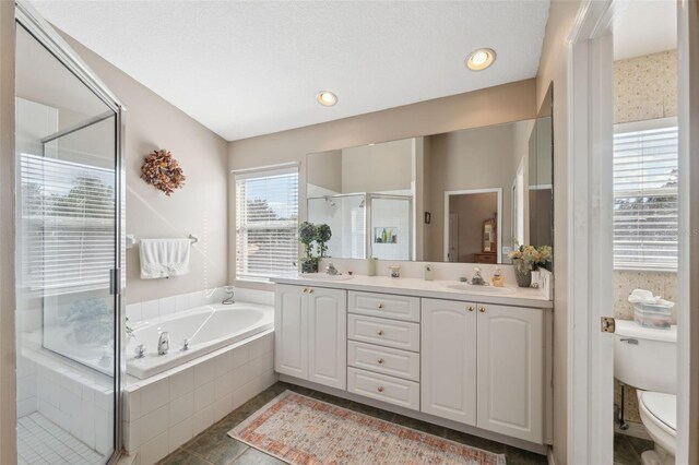 full bathroom with vanity, toilet, separate shower and tub, and tile patterned flooring