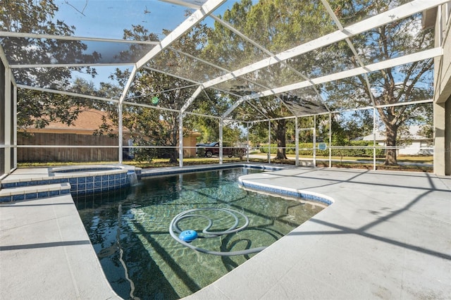 view of pool with an in ground hot tub, a lanai, and a patio area