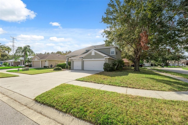 view of front of home with a front yard and a garage