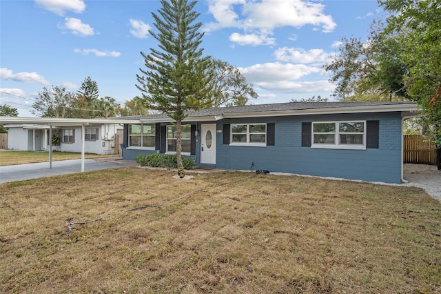 ranch-style house with fence, a front lawn, and brick siding