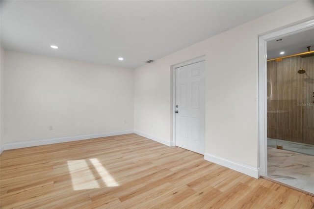 unfurnished room featuring light wood-type flooring