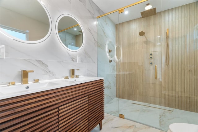 bathroom featuring walk in shower, vanity, and tile walls