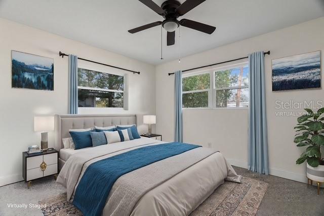 bedroom featuring a ceiling fan and baseboards