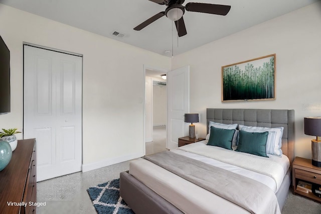 bedroom with a ceiling fan, a closet, visible vents, and baseboards