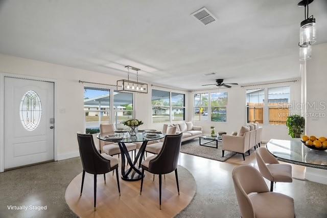 dining area with visible vents and baseboards