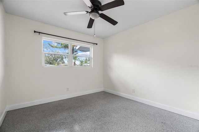 unfurnished room featuring baseboards and a ceiling fan