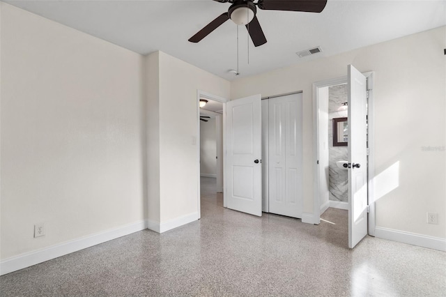 unfurnished bedroom with a closet, visible vents, a ceiling fan, baseboards, and speckled floor