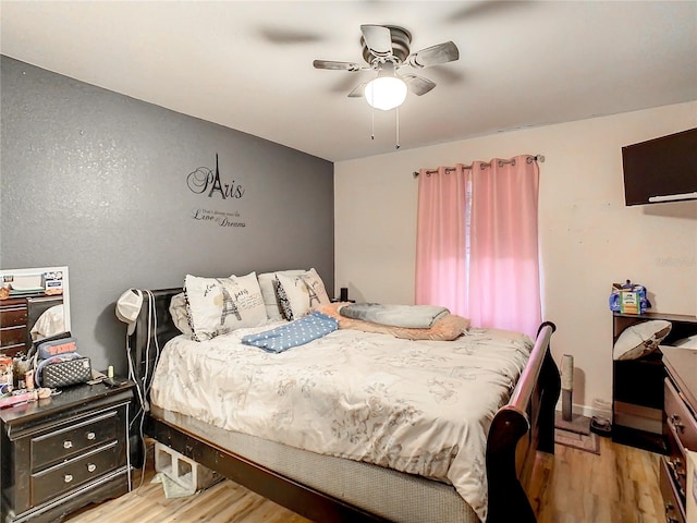 bedroom featuring ceiling fan and light hardwood / wood-style floors