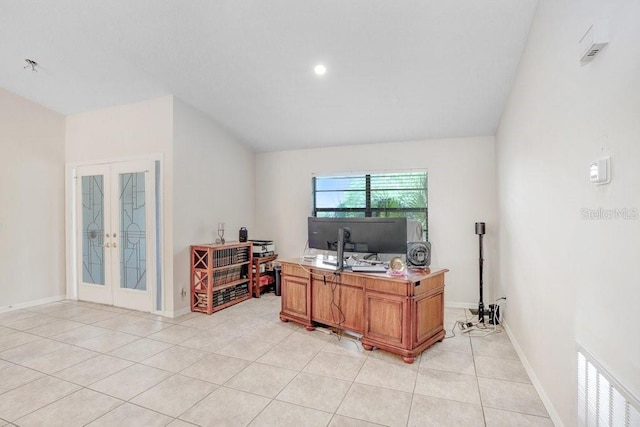 home office featuring lofted ceiling, light tile patterned floors, and french doors