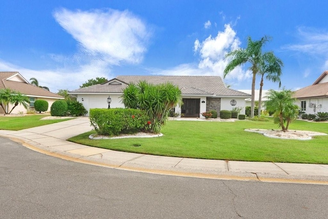 view of front of property with a garage and a front yard