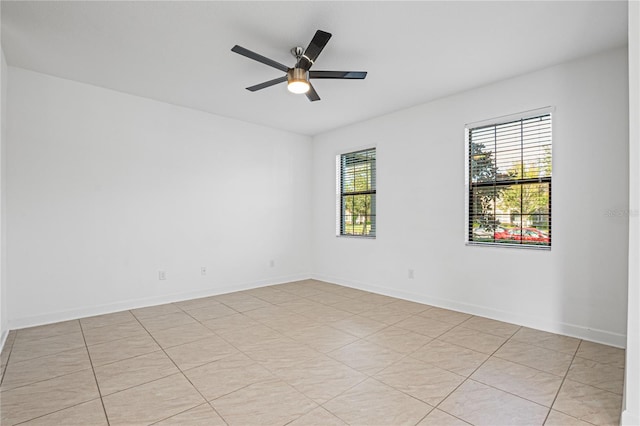 unfurnished room featuring ceiling fan and light tile patterned flooring