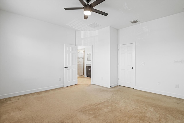 unfurnished bedroom featuring light carpet and ceiling fan