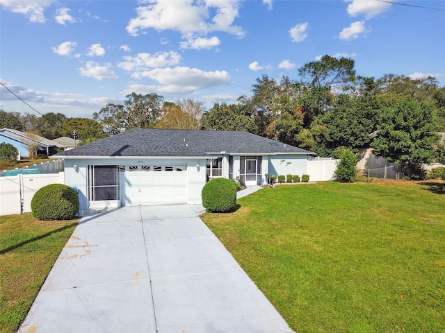 single story home with a front yard and a garage