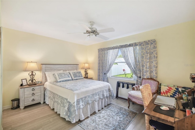 bedroom with wood-type flooring and ceiling fan