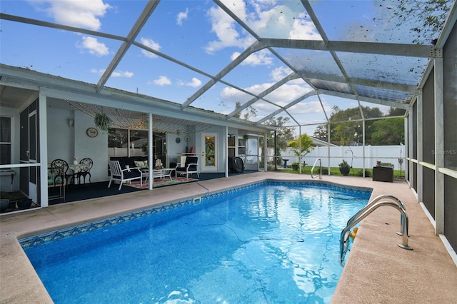 view of swimming pool featuring a lanai and a patio