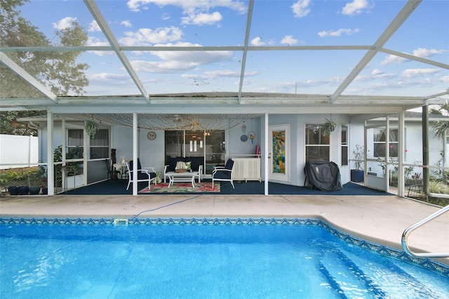 exterior space featuring a lanai, a grill, and a patio area