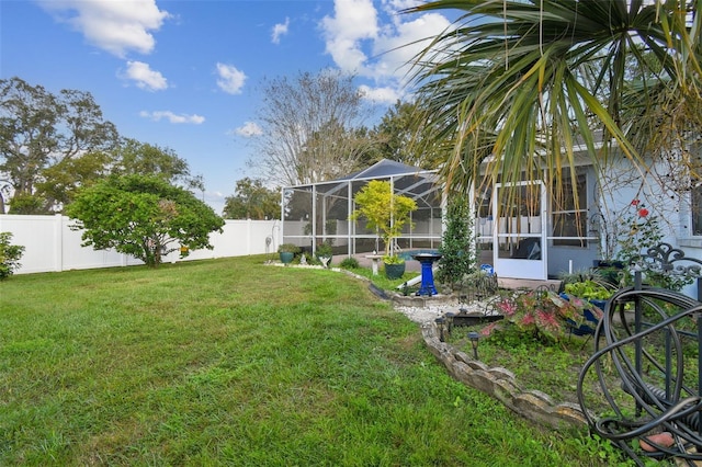 view of yard with glass enclosure