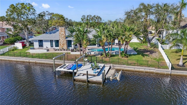 dock area featuring a lawn and a water view