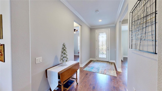 entrance foyer with hardwood / wood-style floors and crown molding