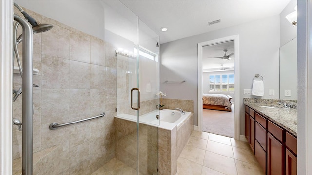 bathroom with tile patterned flooring, vanity, separate shower and tub, and ceiling fan