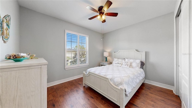 bedroom with dark wood-type flooring and ceiling fan