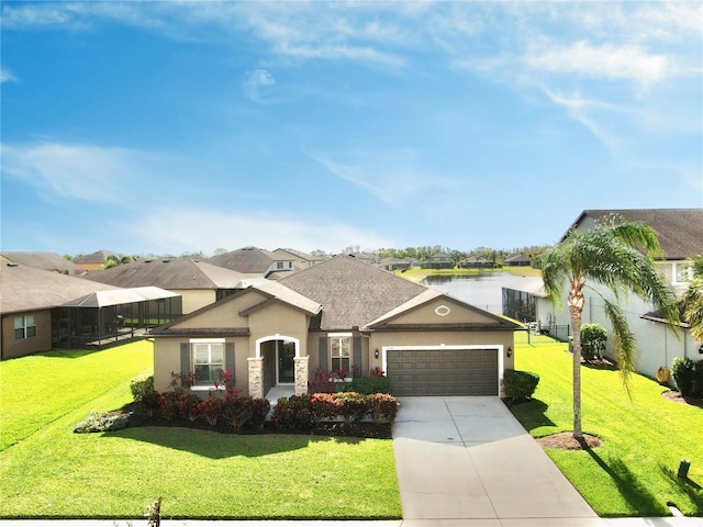 view of front of house with a garage and a front lawn