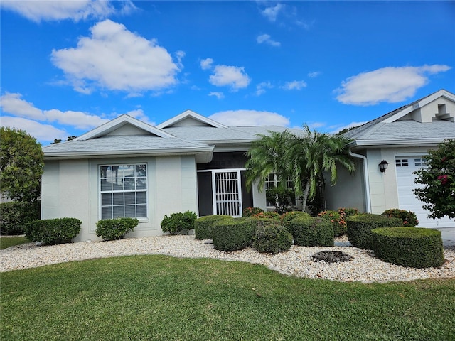 2421 E Del Webb Blvd, Sun City Center, FL 33573 - single story home with a front yard, stucco siding, an attached garage, and roof with shingles