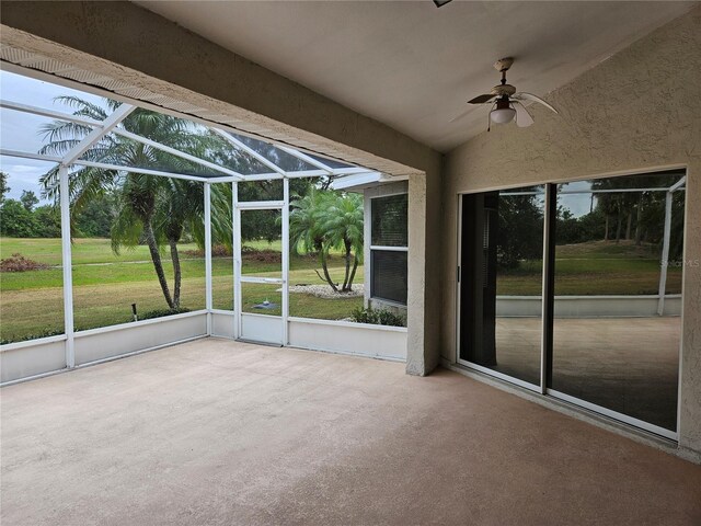 2421 E Del Webb Blvd, Sun City Center, FL 33573 - unfurnished sunroom with ceiling fan, lofted ceiling, and healthy amount of natural light